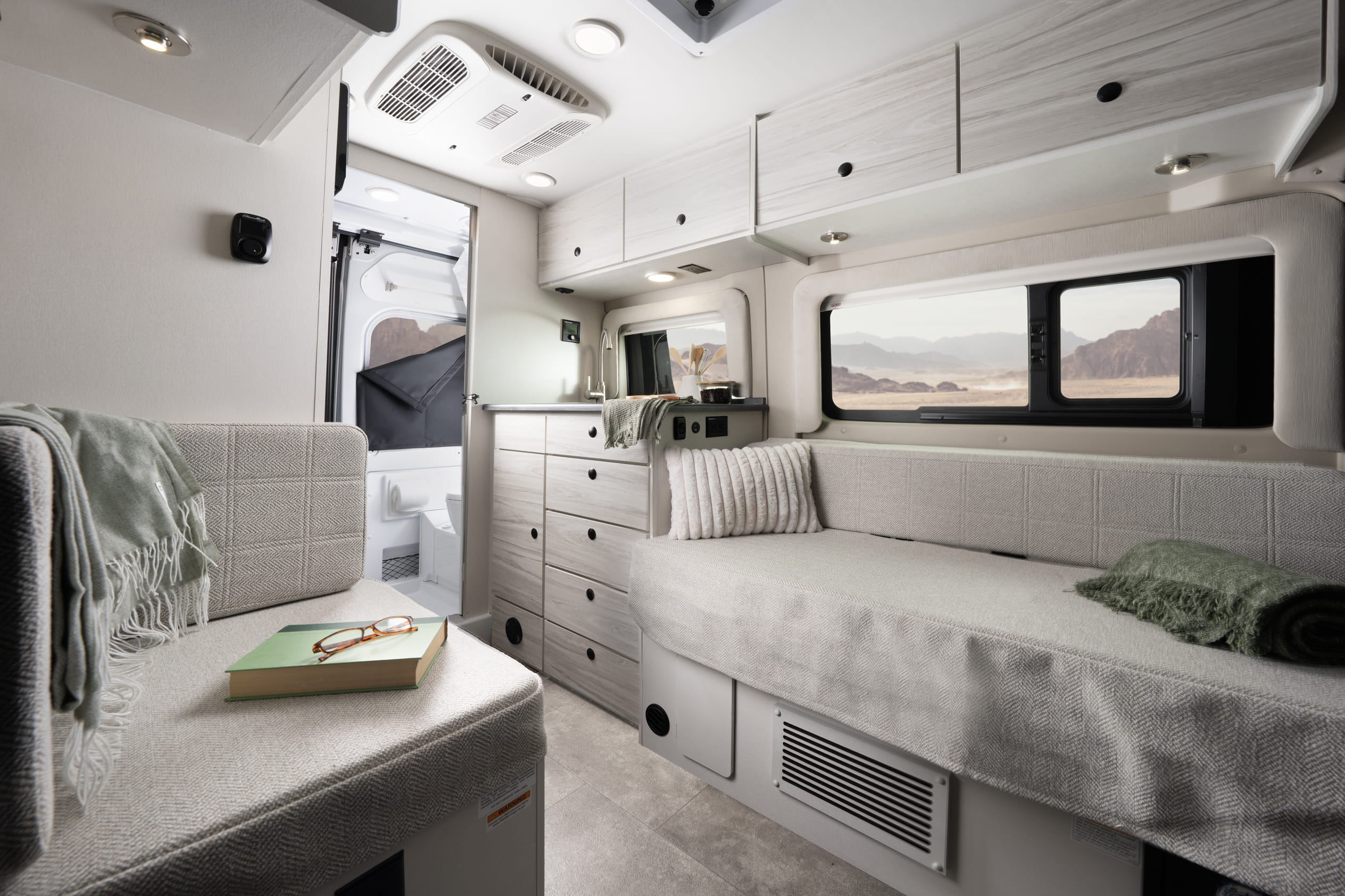 Entegra Coach Arc interior with bed and shelves