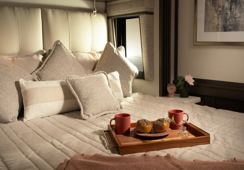 Entegra Coach Centurion bedroom with bed and breakfast tray