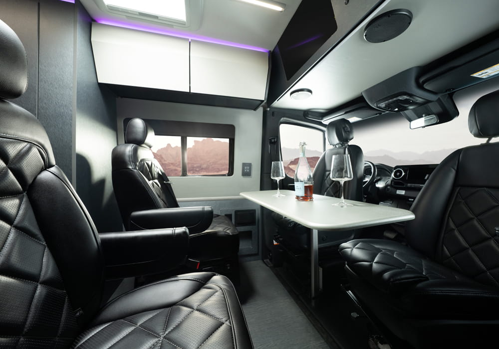 Entegra Coach Insignia interior seating with rear table at desert