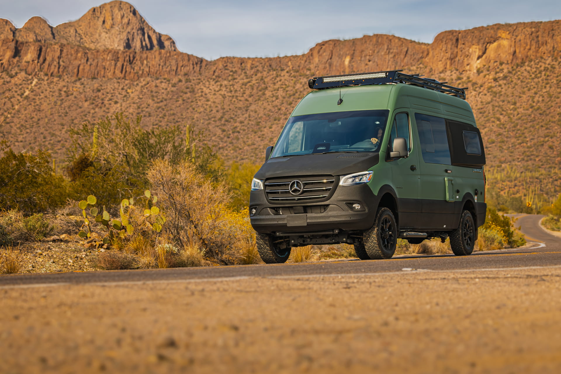 Entegra Coach Class B camper van in desert with saguaro cactus