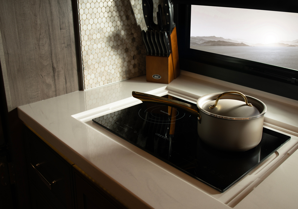 Entegra Coach Centurion kitchen island with cooktop