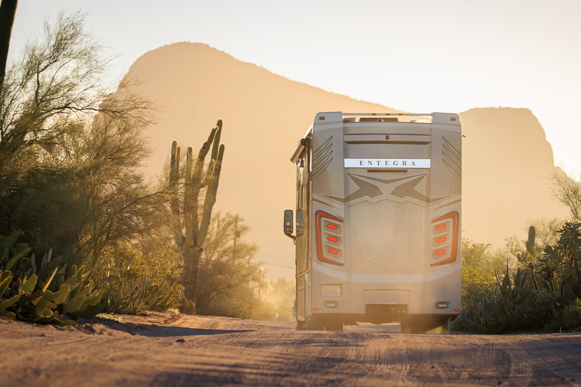 Entegra Coach Class A motorhome in desert at sunset