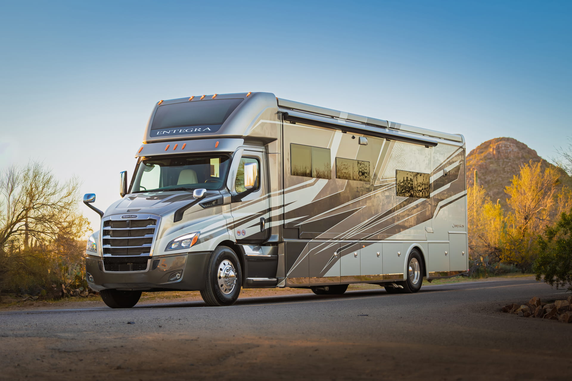 Entegra Coach Super C motorhome in desert with mountain backdrop