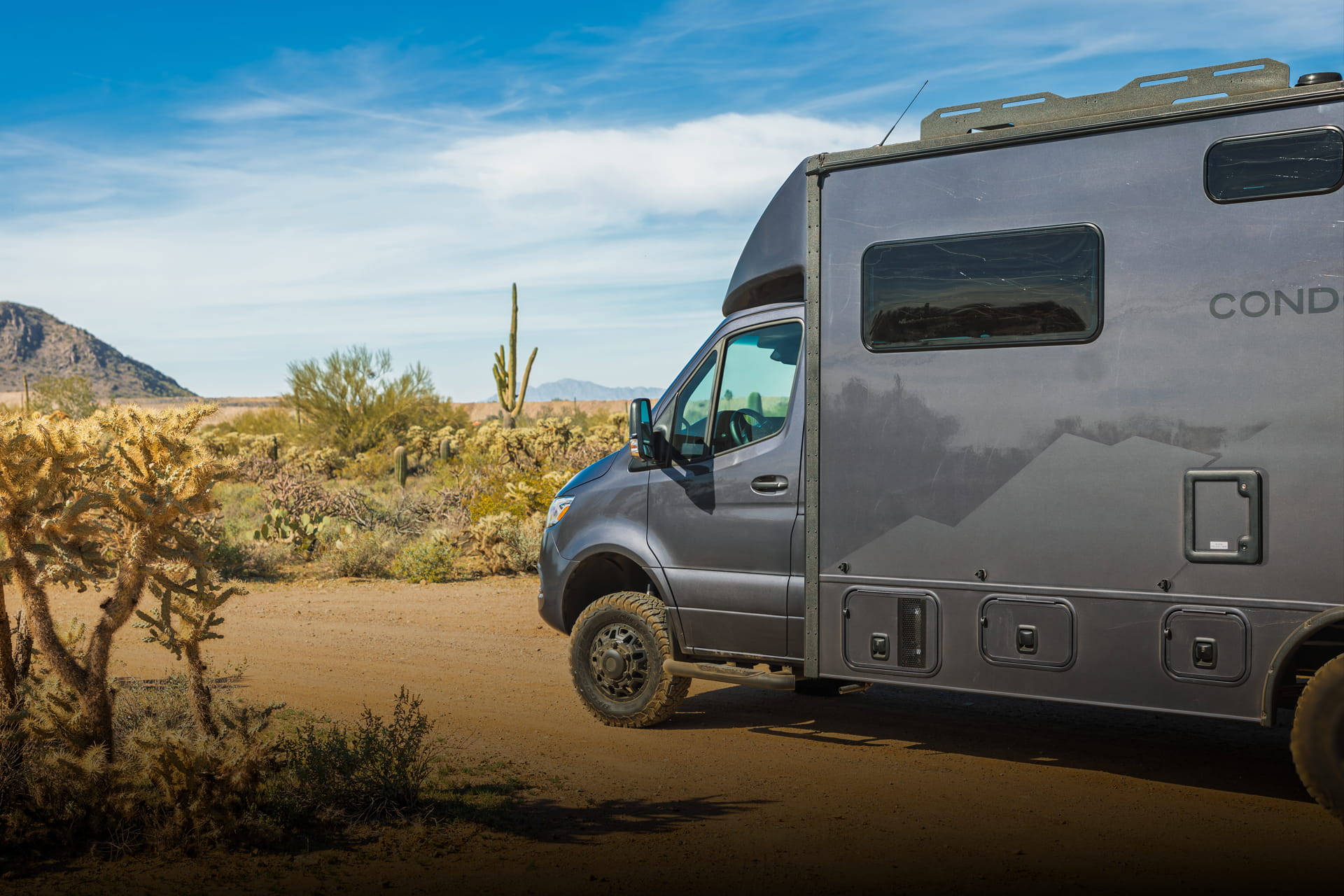 Entegra Coach Class C motorhome in desert with saguaro cactus