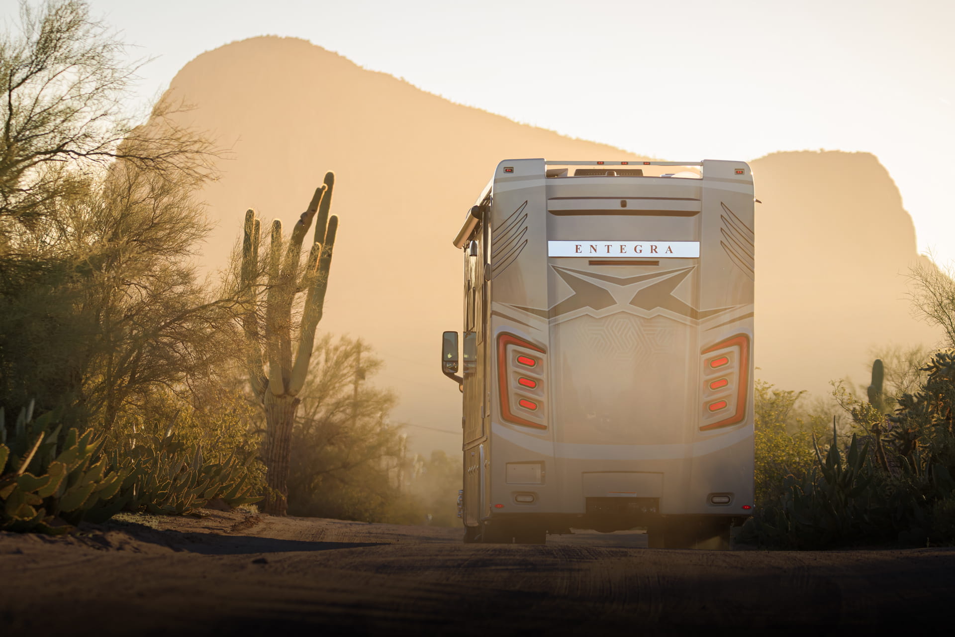 Entegra Coach Super C motorhome in desert at sunset