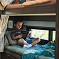 Entegra Coach interior with child reading in bunk