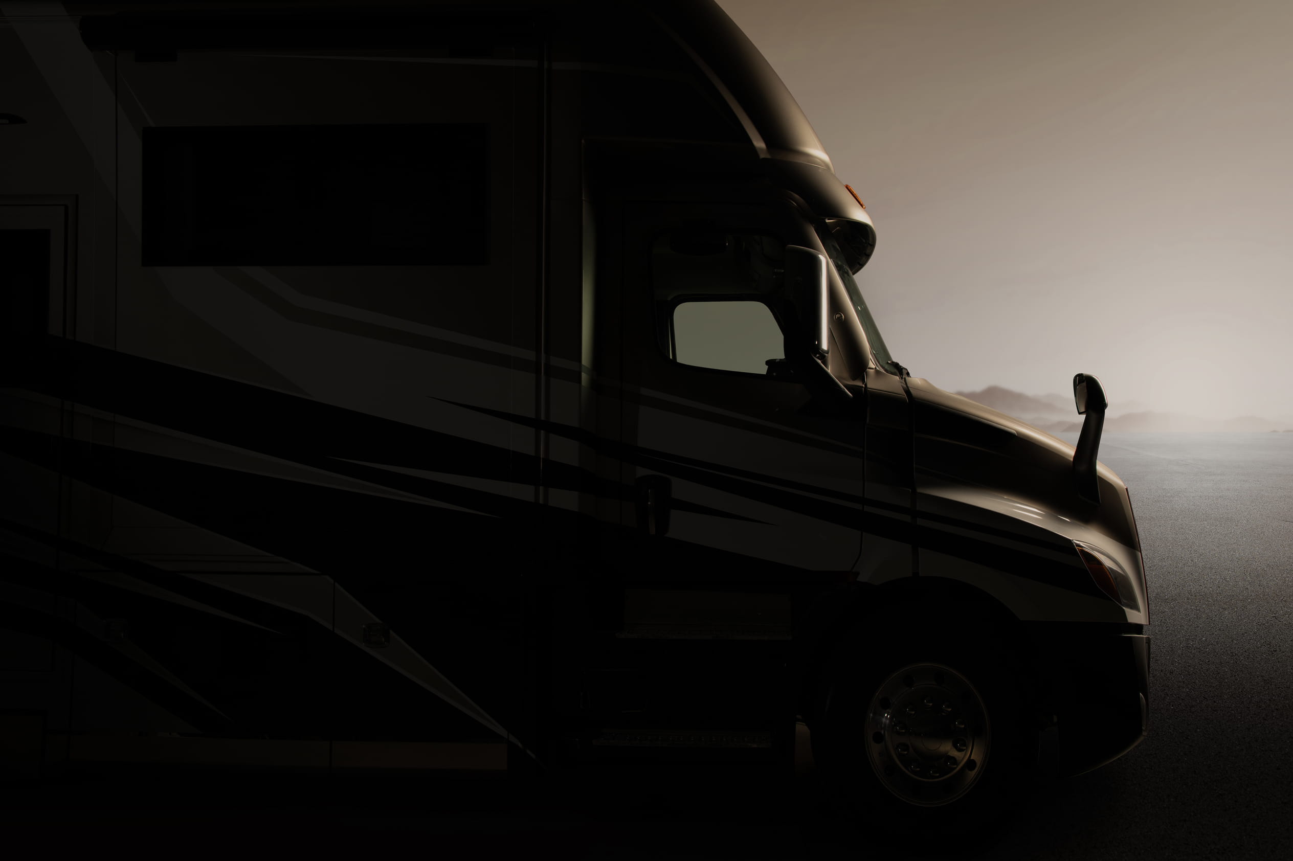 Entegra Coach motorhome exterior silhouette at sunset